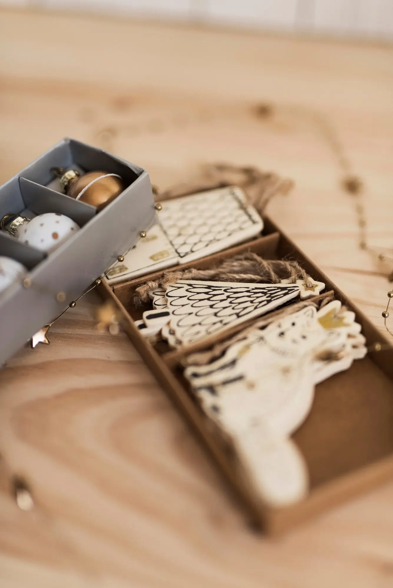 A box containing various Christmas tree ornaments.